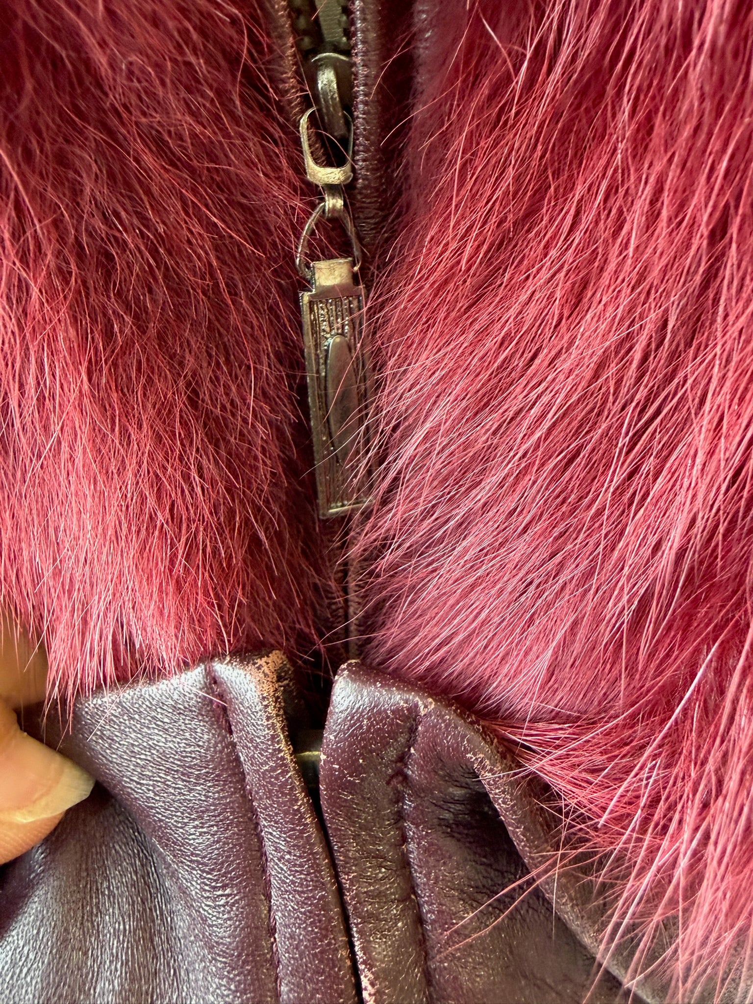 Wine red cropped jacket constructed with plush fox fur on front and collar,