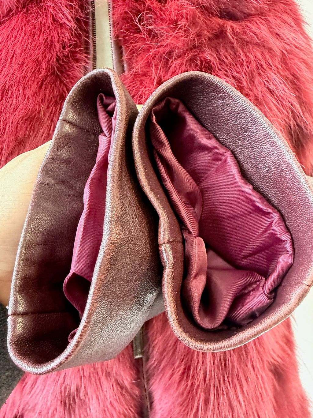 Wine red cropped jacket constructed with plush fox fur on front and collar,