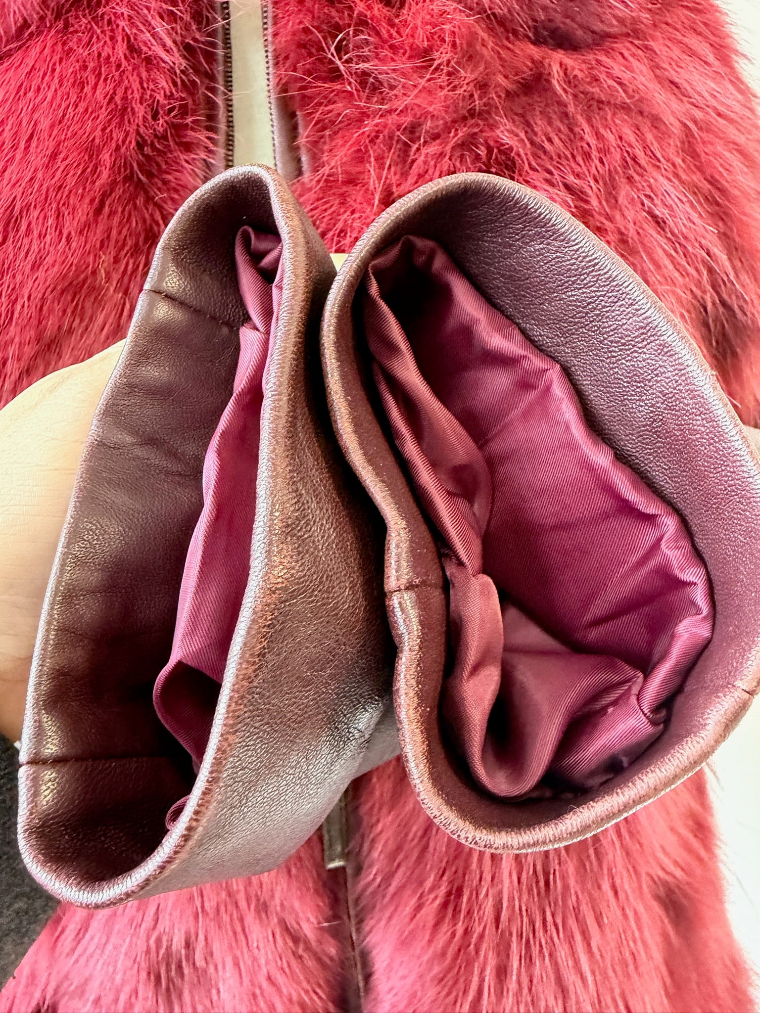 Wine red cropped jacket constructed with plush fox fur on front and collar,