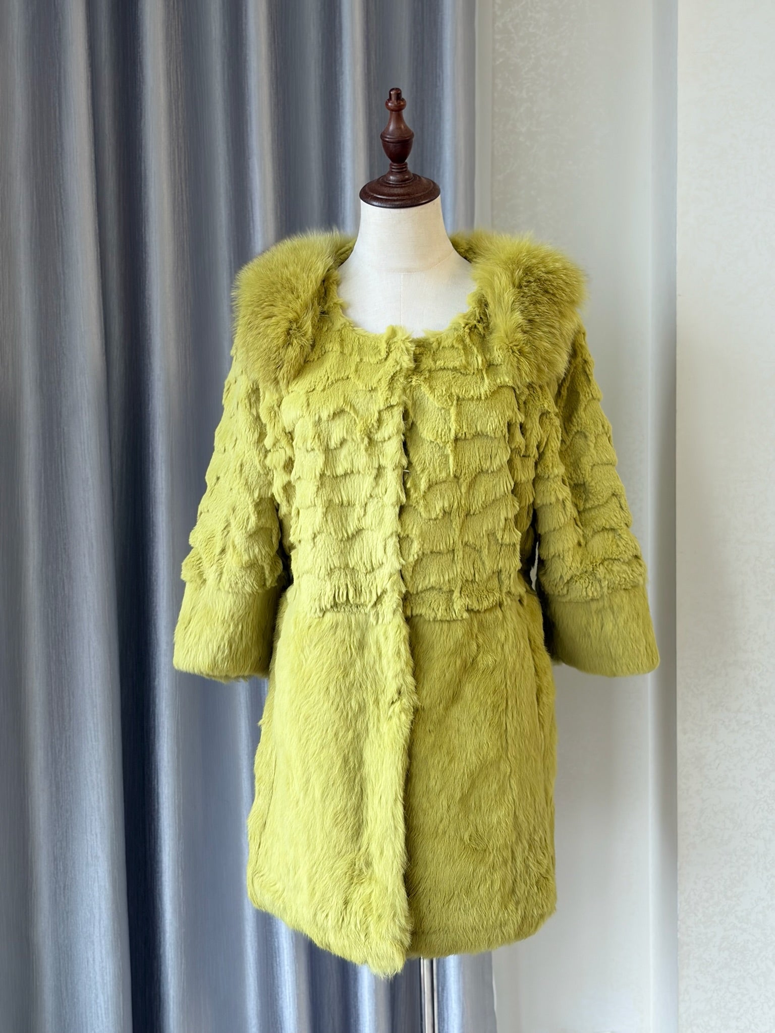 Mustard green rabbit fur textured mid-length fur coat features fluffy shoulder trim,