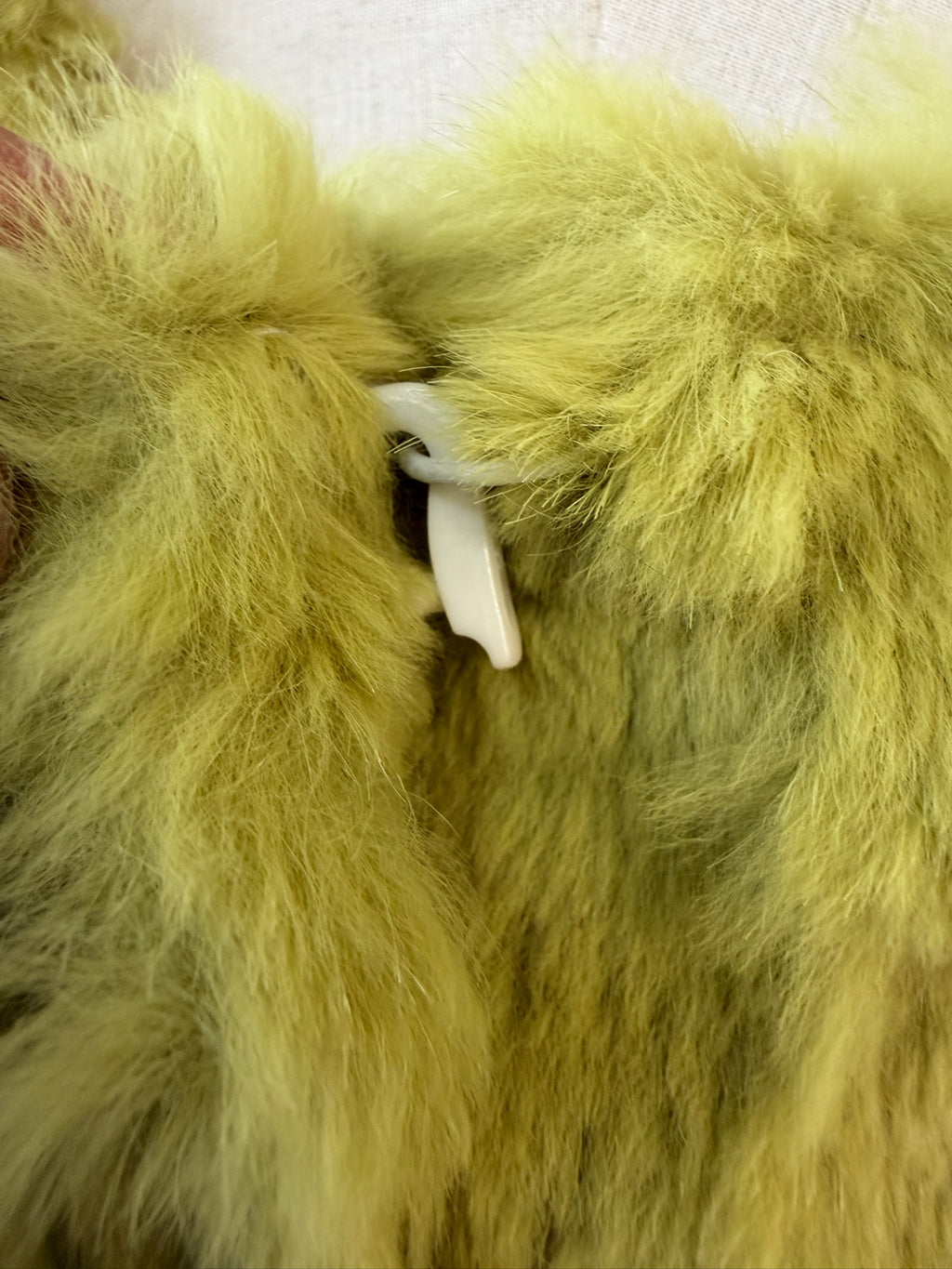 Mustard green rabbit fur textured mid-length fur coat features fluffy shoulder trim,