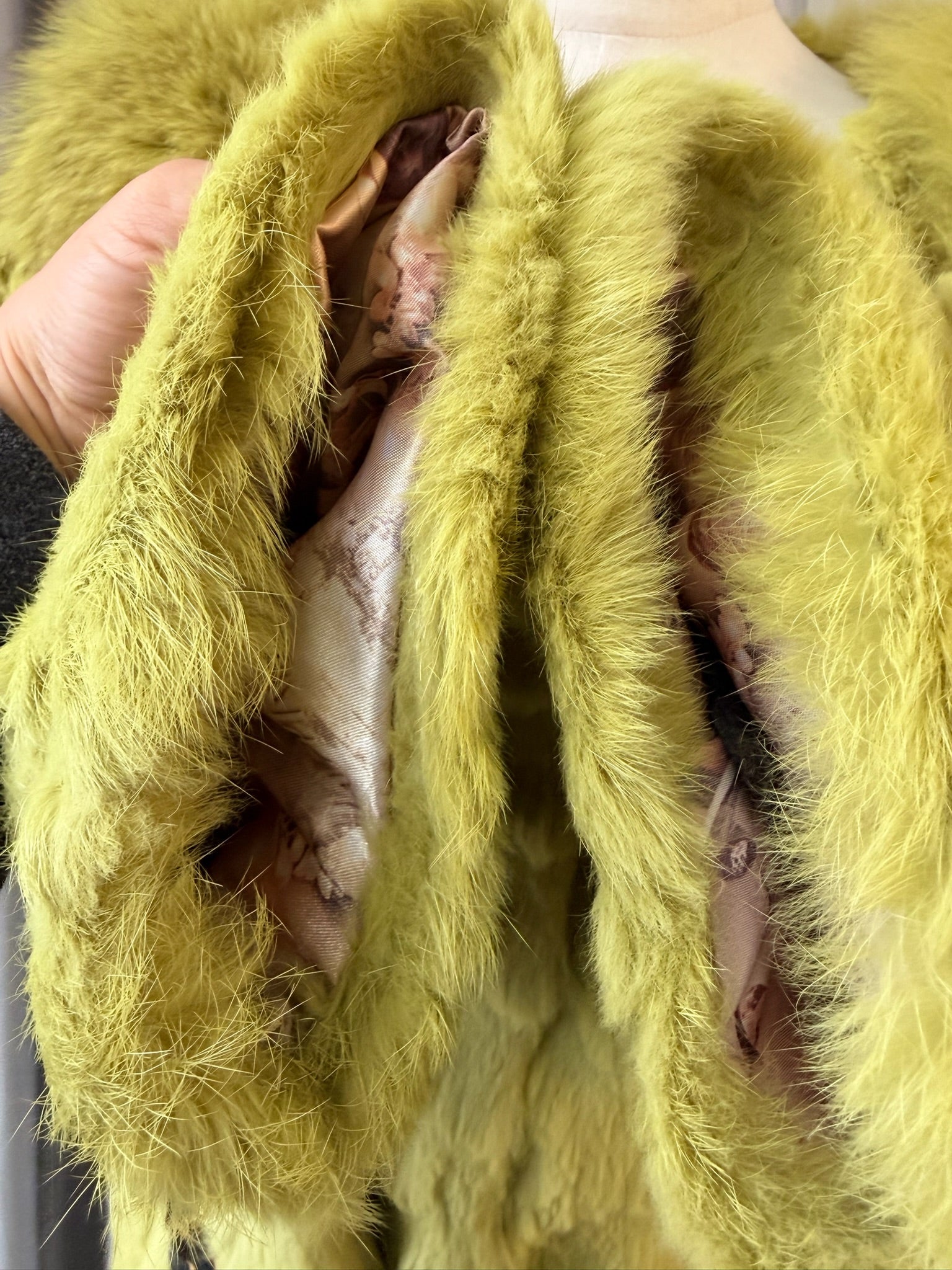 Mustard green rabbit fur textured mid-length fur coat features fluffy shoulder trim,