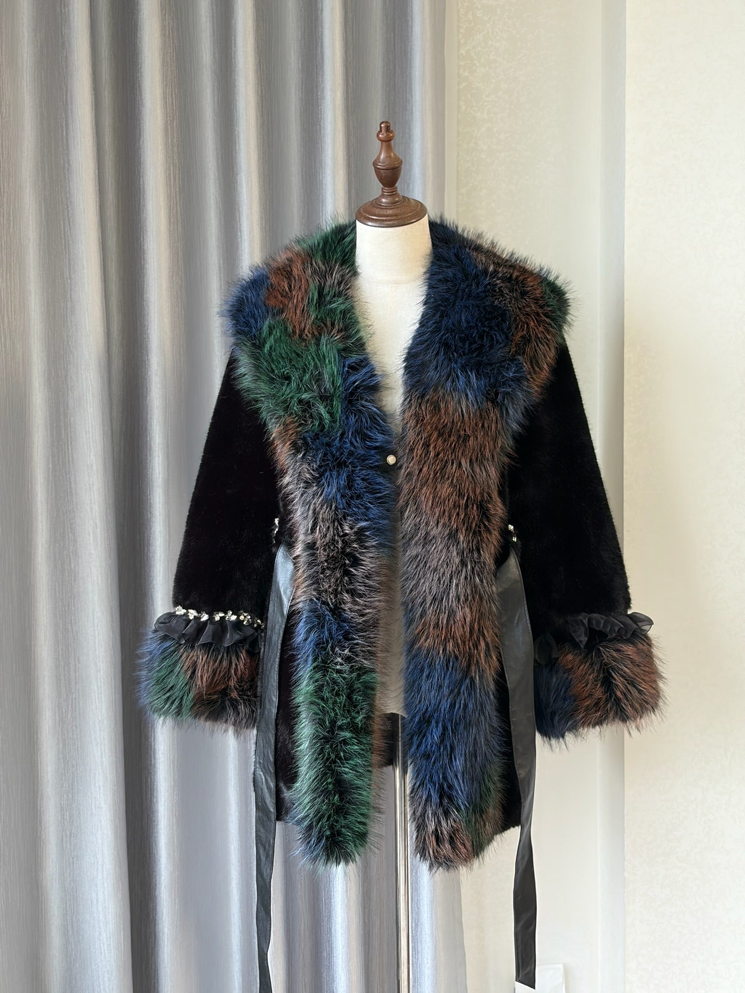 Black plush fur mid-length coat trimmed with multi-toned mixed fur on collar and cuffs