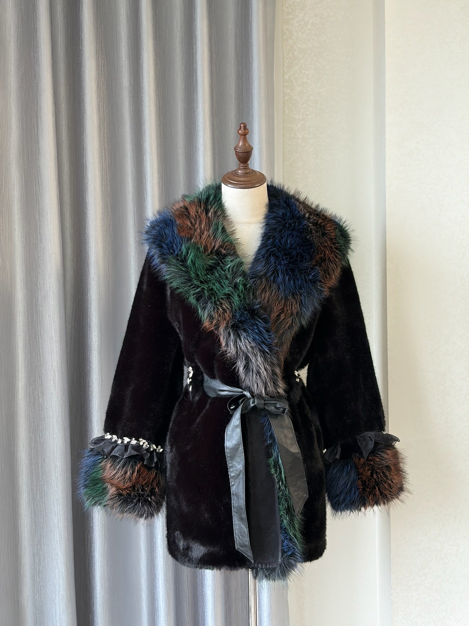 Black plush fur mid-length coat trimmed with multi-toned mixed fur on collar and cuffs