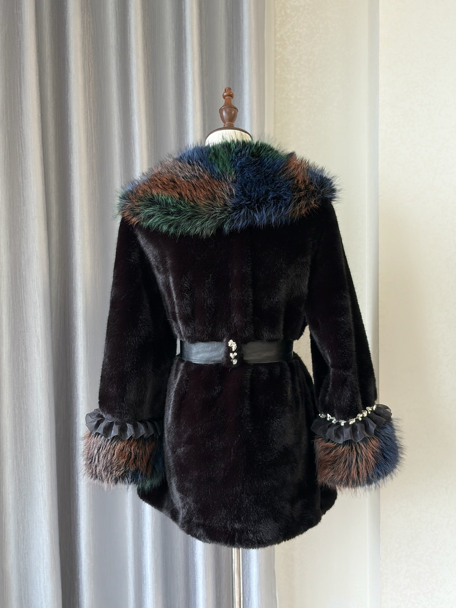 Black plush fur mid-length coat trimmed with multi-toned mixed fur on collar and cuffs