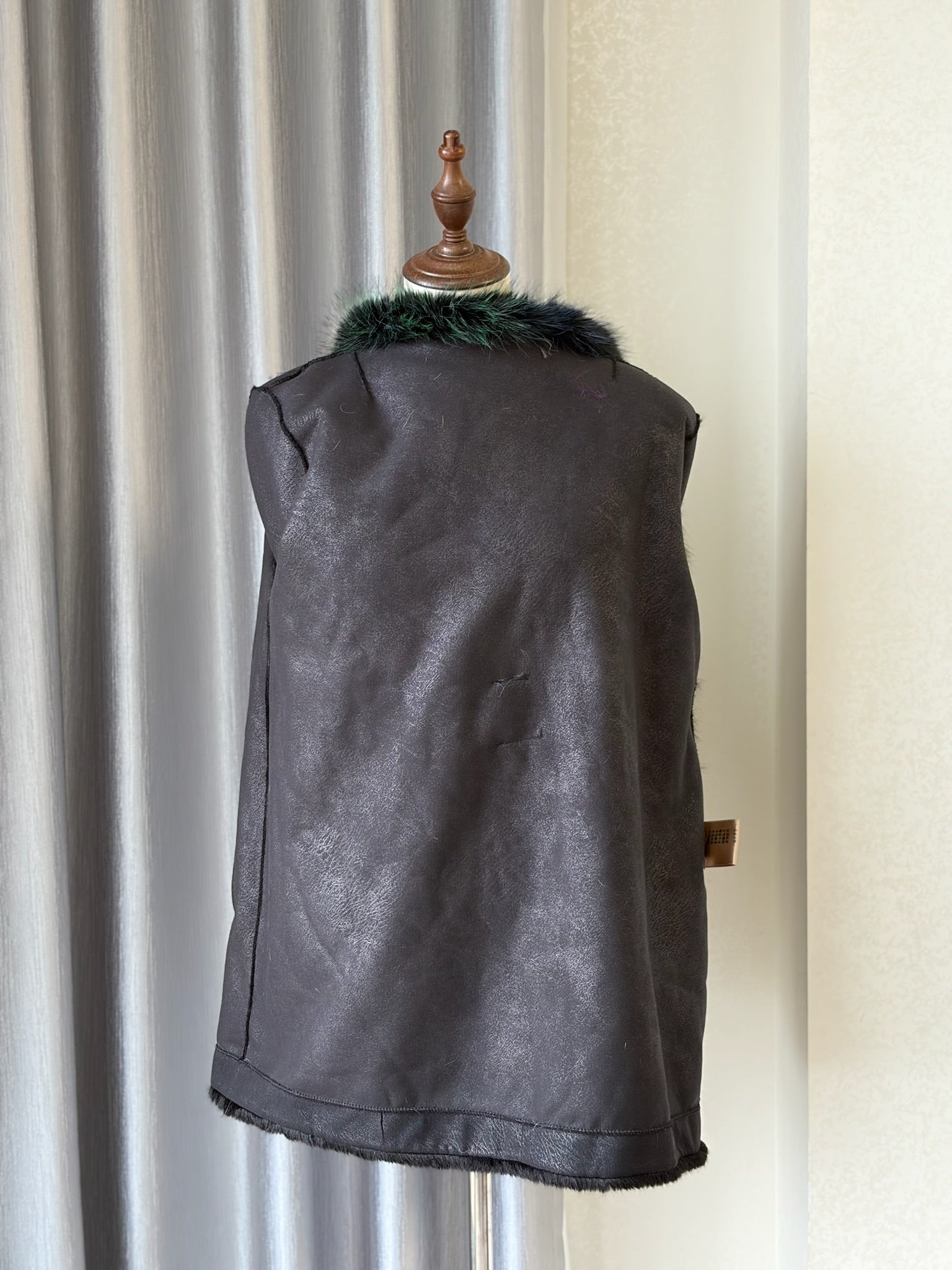 Black plush fur mid-length coat trimmed with multi-toned mixed fur on collar and cuffs