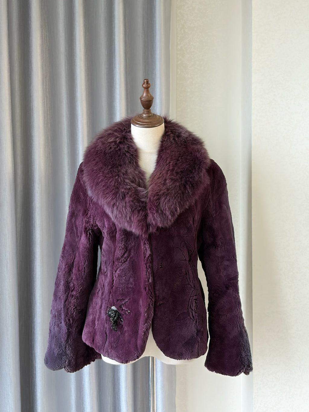 Rich burgundy rabbit fur cropped jacket paired with oversized fluffy fox fur lapel