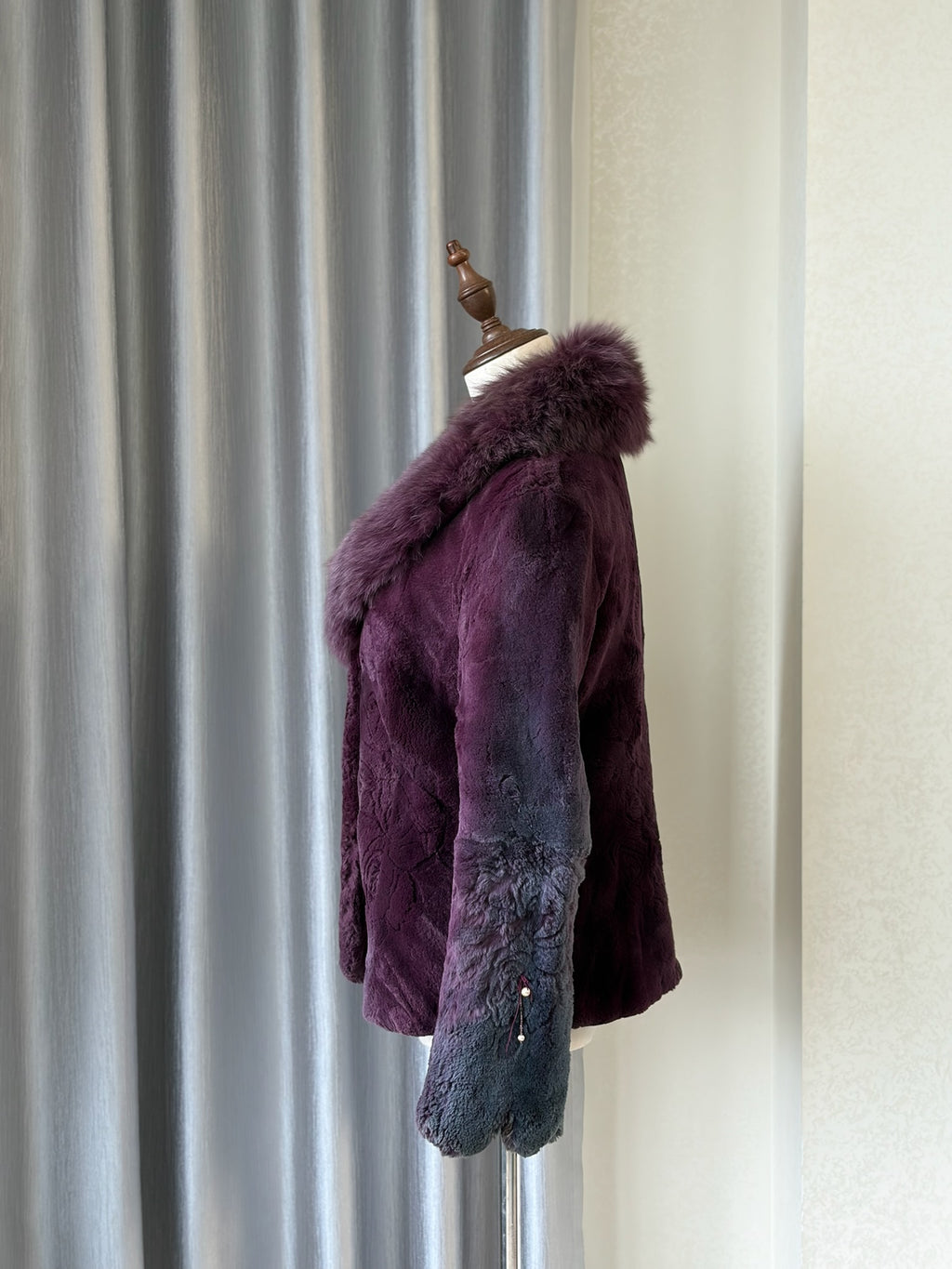Rich burgundy rabbit fur cropped jacket paired with oversized fluffy fox fur lapel