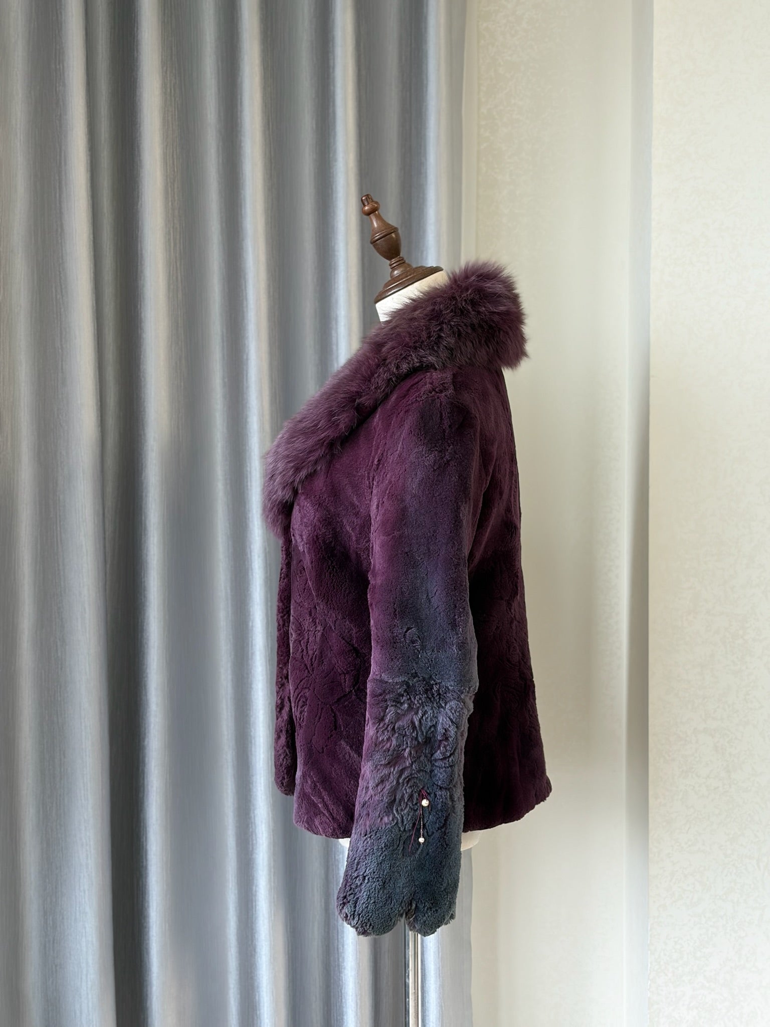 Rich burgundy rabbit fur cropped jacket paired with oversized fluffy fox fur lapel