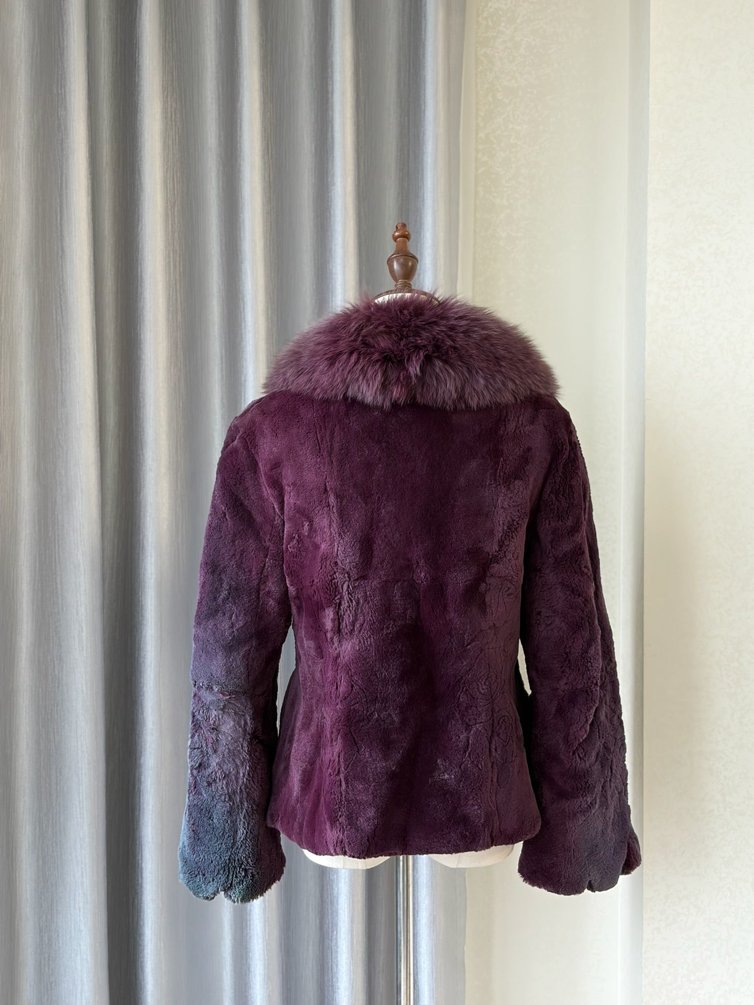 Rich burgundy rabbit fur cropped jacket paired with oversized fluffy fox fur lapel