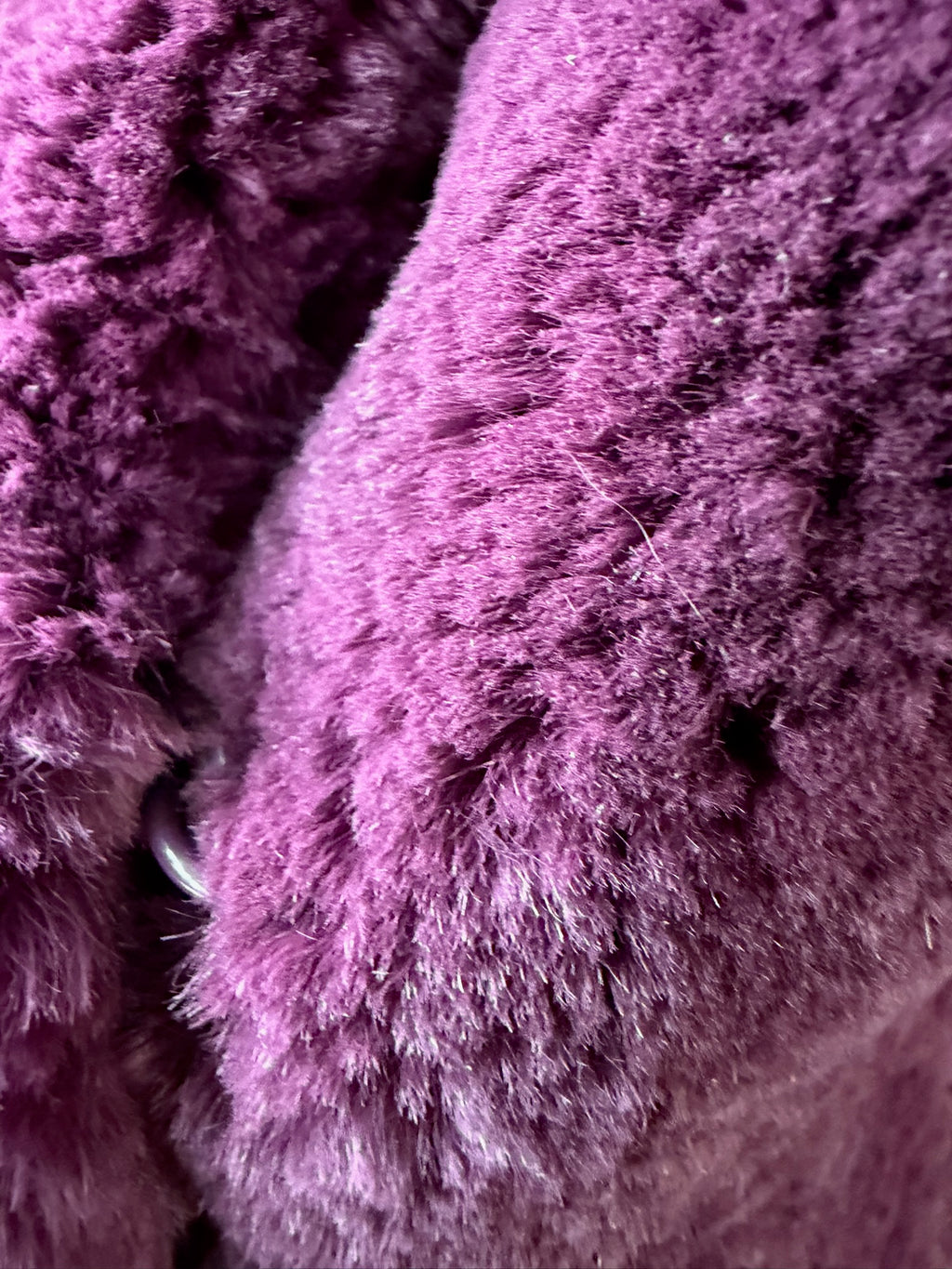 Rich burgundy rabbit fur cropped jacket paired with oversized fluffy fox fur lapel