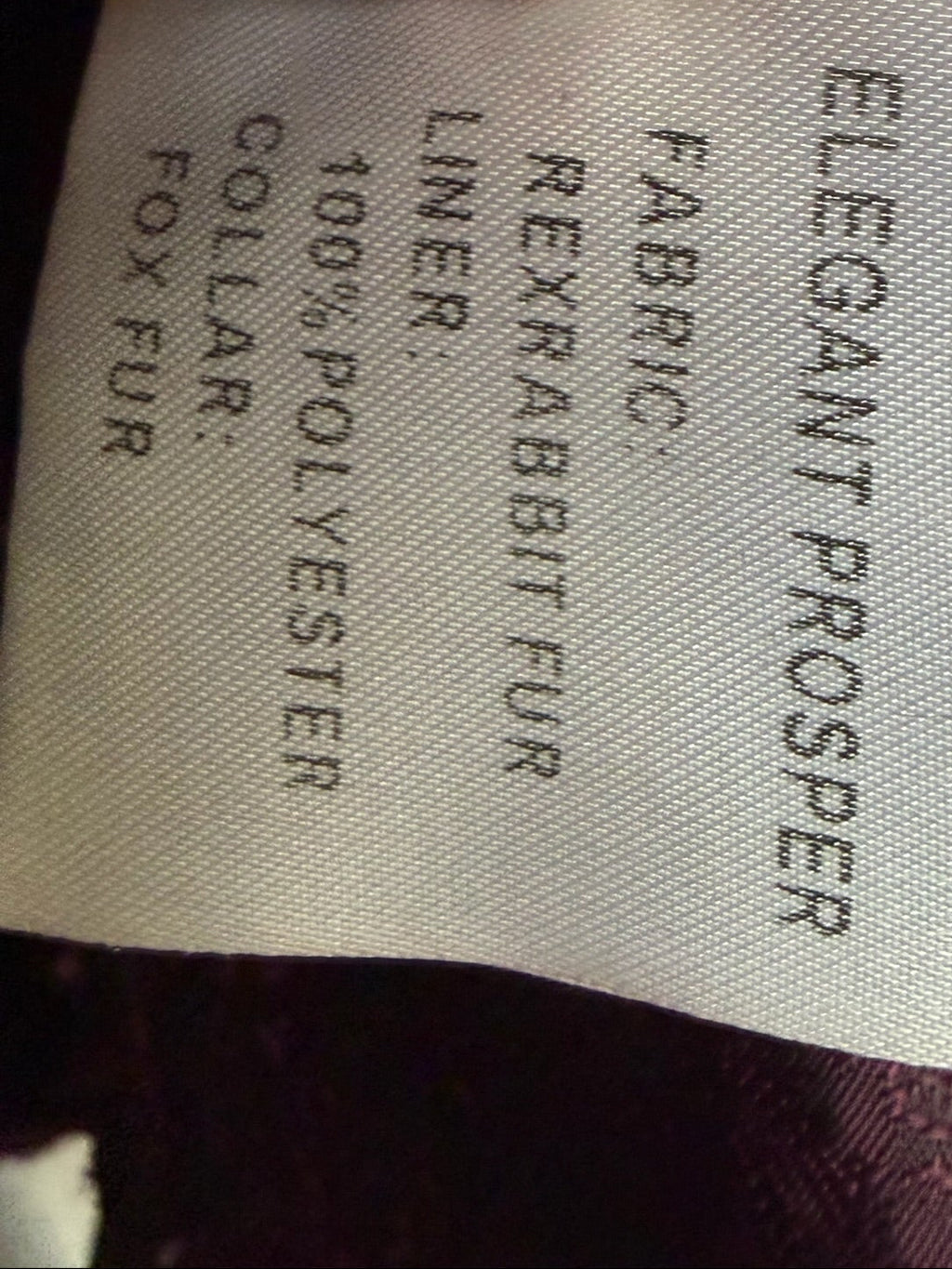 Rich burgundy rabbit fur cropped jacket paired with oversized fluffy fox fur lapel