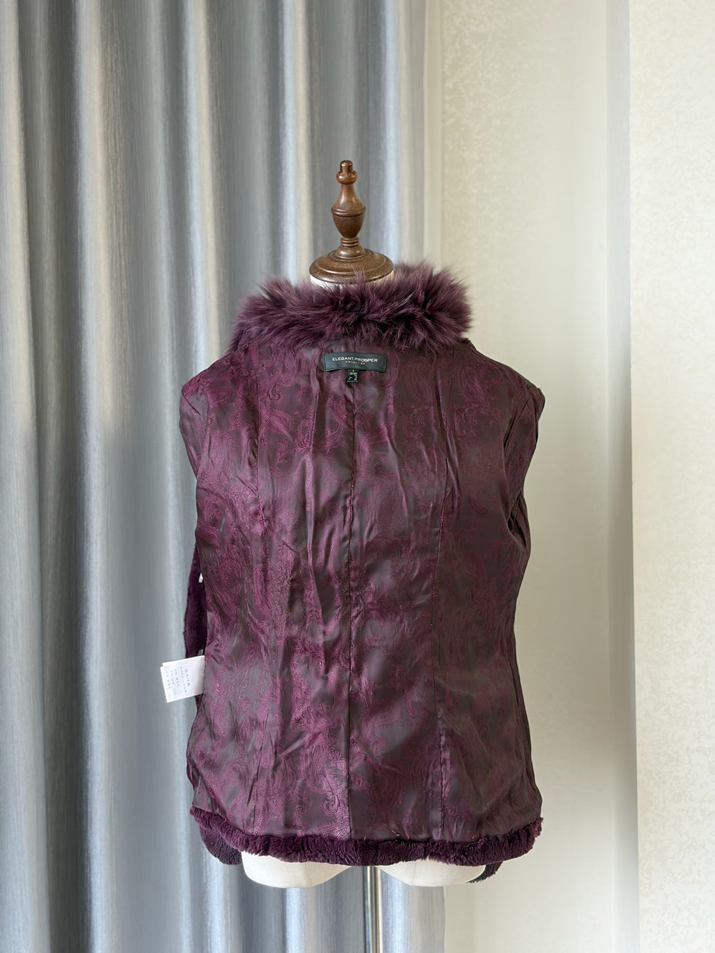 Rich burgundy rabbit fur cropped jacket paired with oversized fluffy fox fur lapel