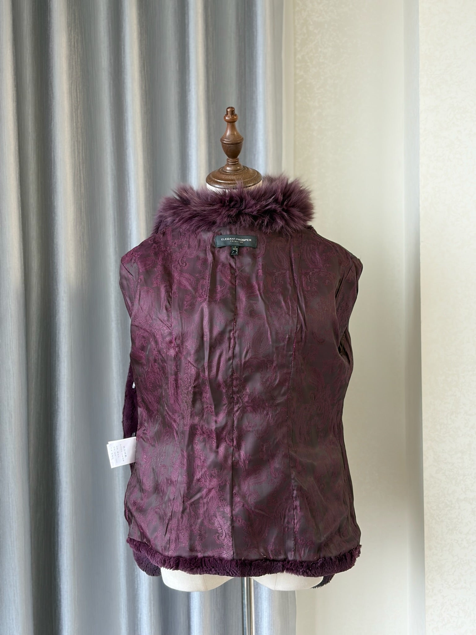 Rich burgundy rabbit fur cropped jacket paired with oversized fluffy fox fur lapel