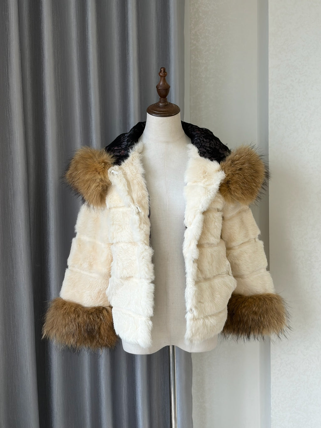 Cream-white horizontally-seamed fur jacket