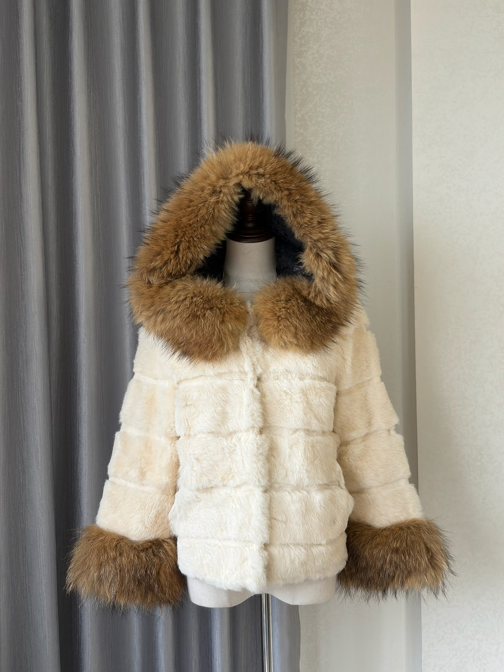 Cream-white horizontally-seamed fur jacket