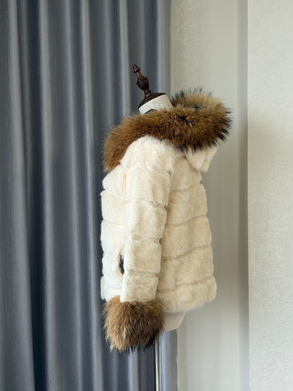 Cream-white horizontally-seamed fur jacket