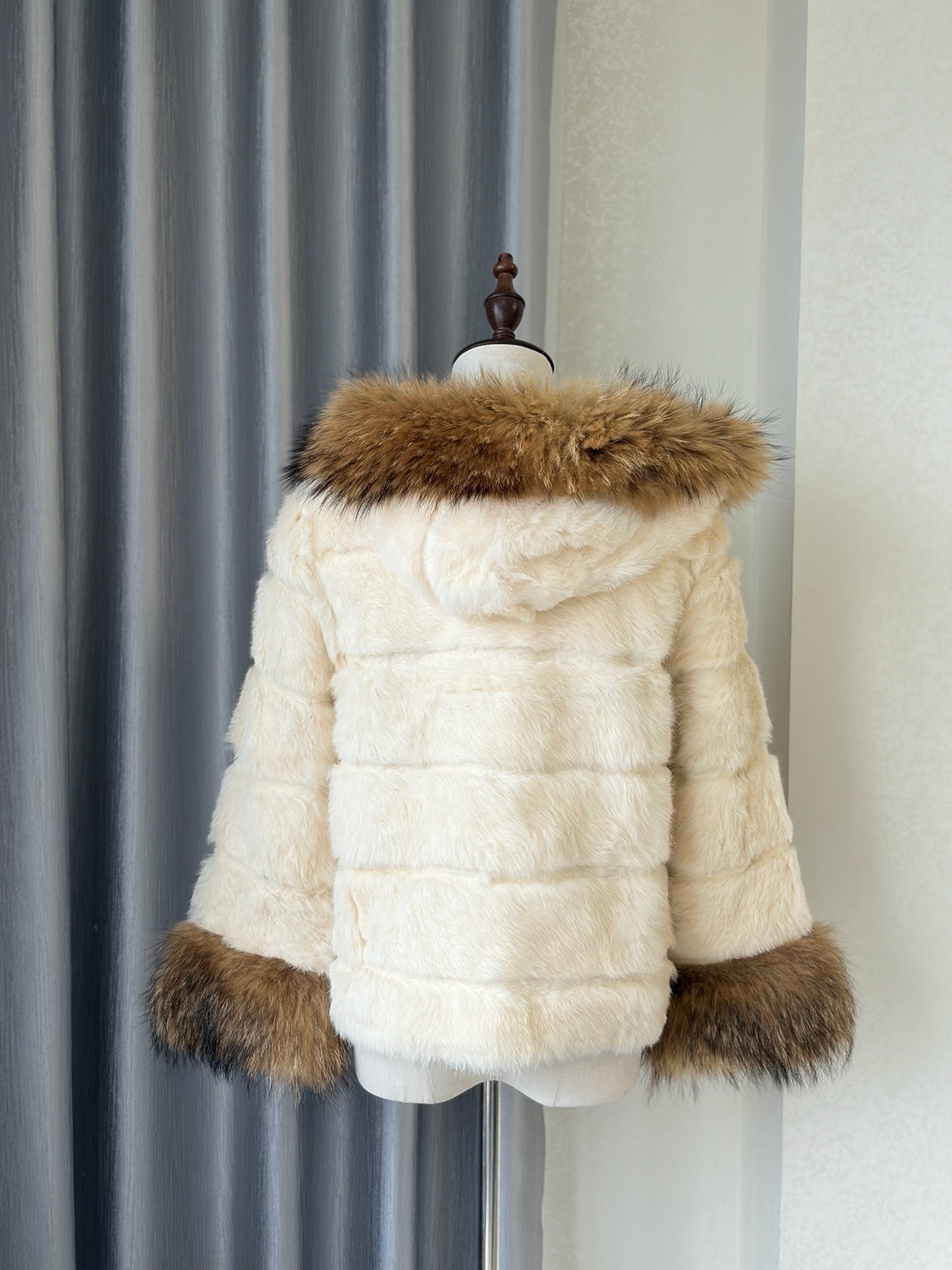 Cream-white horizontally-seamed fur jacket