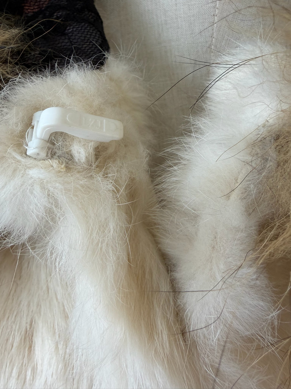 Cream-white horizontally-seamed fur jacket