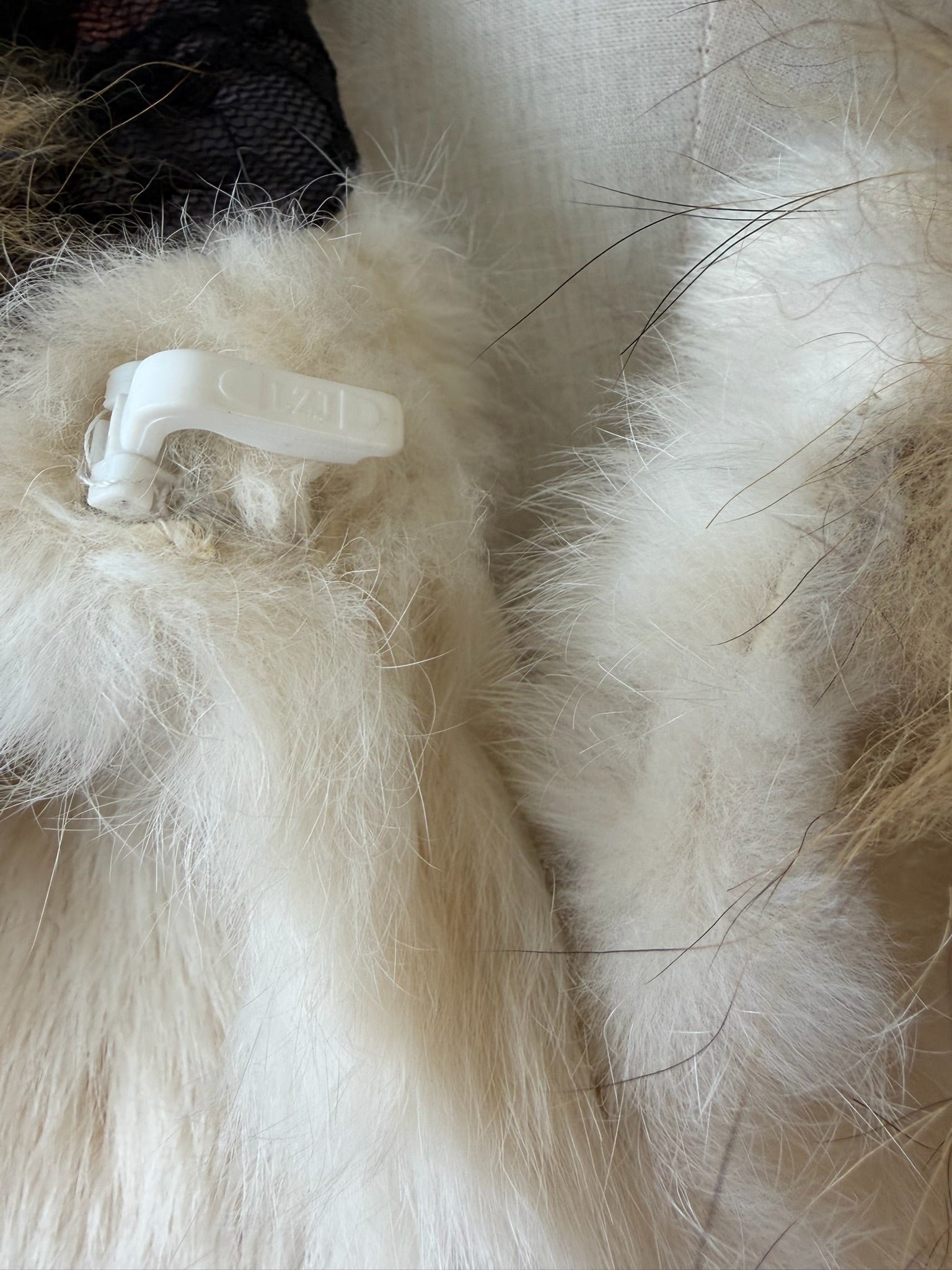 Cream-white horizontally-seamed fur jacket