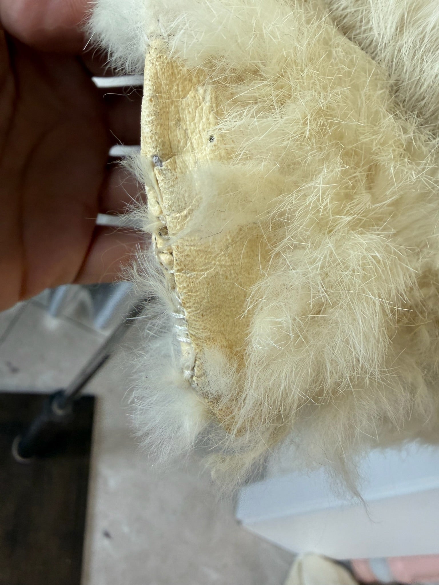 Off-white horizontally segmented cropped fur coat